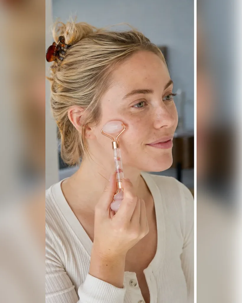 Illustrative adult model using a rose quartz facial roller